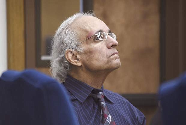 FILE - In this May 10, 2019 file photo Tracy Petrocelli, 67, a convicted murderer who has been on death row in Nevada for 34 years, listens to testimony during his re-sentencing hearing in Washoe District Court in Reno, Nev. A week-long re-sentencing hearing is nearing the end for Petrocelli. Closing arguments were scheduled in state court in Reno Thursday, May 16, 2019. (Jason Bean/The Reno Gazette-Journal via AP, Pool, File)