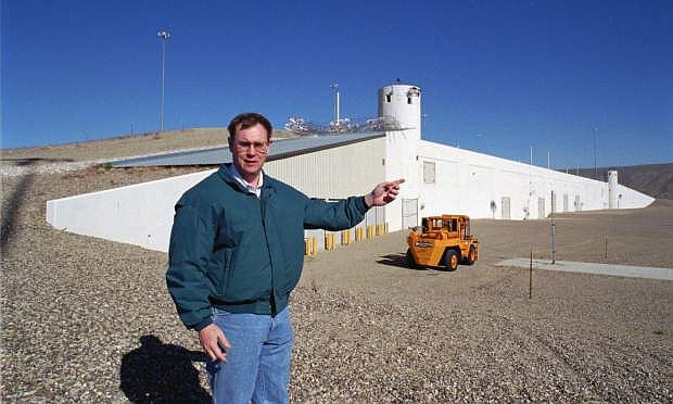 FILE - In this Feb. 18, 1997 file photo John McGrail, director of the Department of Energy stockpile stewardship program, talks about the $100 million Device Assembly Facility behind him at the Nevada Test Site in Mercury, Nev. Nevada&#039;s U.S. senators and Energy Secretary Rick Perry are set to tour the site north of Las Vegas where the federal government is handling weapons-grade plutonium shipped from South Carolina. Aides say the Friday, May 10, 2019, visit to the Device Assembly Facility at the Nevada National Security Site and briefings with Democratic Sens. Catherine Cortez Masto and Jacky Rosen will be closed to the media and public.  (AP Photo/Lennox McLendon, File)