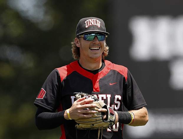 FILE - In this Sunday, May 5, 2019, file photo, UNLV&#039;s Bryson Stott (10) smiles prior to an NCAA college baseball game against the University of Houston, in Houston.  Stott is ready to follow in the footsteps of superstars Kris Bryant and Bryce Harper, as the next major-league hit from southern Nevada. The UNLV junior is projected to go in the first round of June&#039;s MLB Draft, and it&#039;s the All-American candidate shortstop&#039;s humility that might be his most impressive trait. (AP Photo/Aaron M. Sprecher, File)