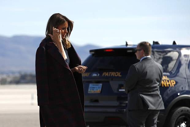 FILE - In this March 5, 2019 file photo first lady Melania Trump boards an aircraft at McCarran International Airport in Paradise, Nev. Nevada&#039;s rising political prominence is attracting more visits from the president, vice president and other high-profile political figures that are driving up costs for state troopers assigned to help protect them while they&#039;re in the state. It&#039;s expected to be even more costly next year, with Trump&#039;s re-election campaign targeting swing-state Nevada and a crowded field of Democrats who might start receiving protection as they barnstorm the state. (AP Photo/Patrick Semansky,File)