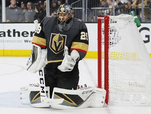 Vegas Golden Knights goaltender Marc-Andre Fleury (29) makes a save against the San Jose Sharks during the third period in Game 6 of a first-round NHL hockey playoff series Sunday, April 21, 2019, in Las Vegas. (AP Photo/John Locher)