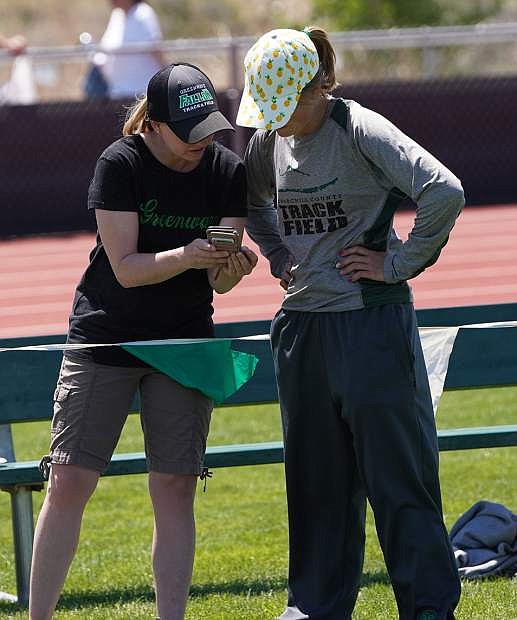 Fallon pole vault coach Mandie Lister talks with senior Glenda Lee after one of her vaults on Saturday.