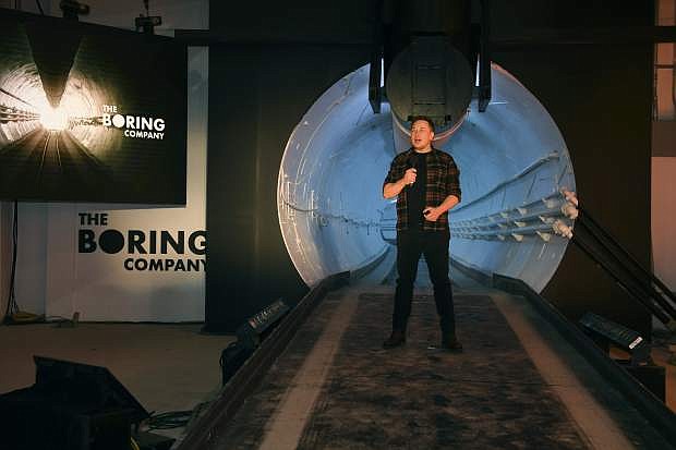 Elon Musk, co-founder and chief executive officer of Tesla Inc., speaks during an unveiling event for the Boring Co. Hawthorne test tunnel in Hawthorne, Calif., on Dec. 18.