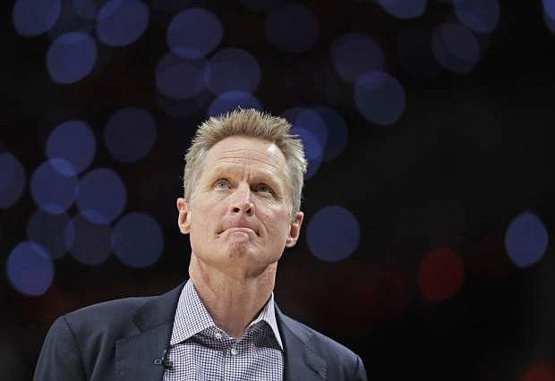 Golden State Warriors head coach Steve Kerr looks toward the scoreboard during the first half of Game 4 of the NBA basketball playoffs Western Conference finals against the Portland Trail Blazers, Monday, May 20, 2019, in Portland, Ore. (AP Photo/Ted S. Warren)