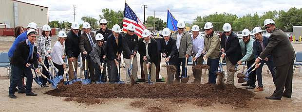 Fallon Mayor Ken Tedford (center) leads government officials and community members in a groundbreaking ceremony for a new youth center.