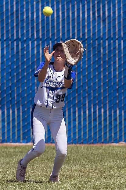 Lauren Hawkins catches a flyball for Carson against Douglas on Saturday.