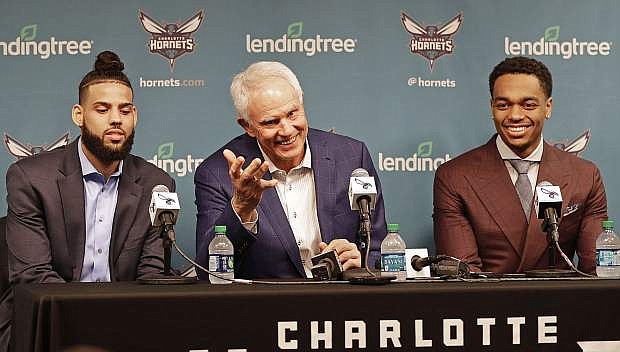 Charlotte Hornets general manager Mitch Kupchak, center, speaks as draft picks Cody Martin, left, and PJ Washington listen during a news conference in Charlotte, N.C., on June 21. Kupchak said the Wolf Pack&#039;s Martin played at UNLV.