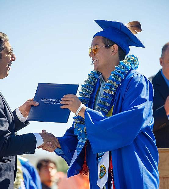 Carson High Graduate Garrett Clampitt receives his diploma during Carson High School Graduation, Carson City, Nevada.