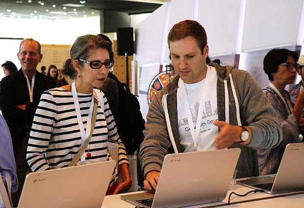 Reno-based social media manager Paige Wadleigh, left, gets assistance from a Googler during the inaugural Grow with Google event Monday, Aug. 6, 2018, at the Nevada Museum of Art in Reno.