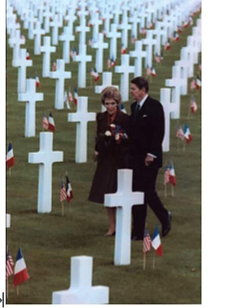 The President and Mrs. Reagan pausing to spend time with those who perished at Omaha Beach.