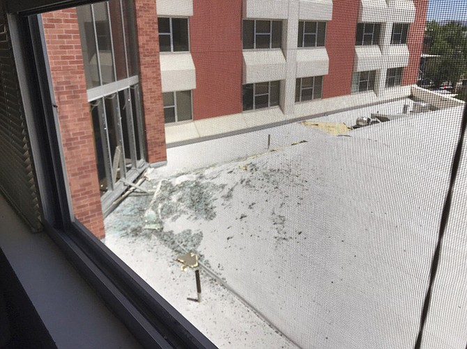In this photo provided by Raven Green, is damage to a dormitory building with windows blown out and other debris that fell after an explosion at the University of Nevada, Reno, Friday, July 5, 2019, in Reno, Nev. Authorities say a utilities explosion at the university caused the partial collapse of a dormitory building and at least minor injuries. Student Raven Green told The Associated Press she was in her room at Argenta Hall watching Netflix when she heard a loud boom and felt the building shake. (Raven Green via AP)