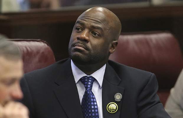Then-state Sen. Kelvin Atkinson, D-North Las Vegas, listens to debate on the Senate floor at the Legislative Building in Carson City on May 22, 2013.