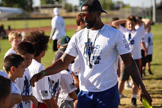 Ex-Division I football player Brandon Sanders, who coaches as an assistant for the Greenwave football and boys basketball teams, created Mind of a Champion football camp, which concluded its second year earlier this month.