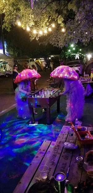 Lisa Yesitis and her friend Debi Portelance play a game of foosball while dressed in their mushroom outfits last year.
