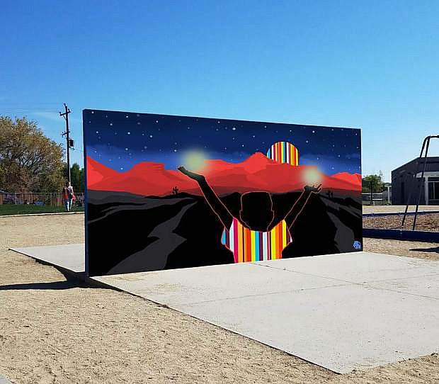 Bill Louis, one of two artists selected to create a mural for the Empire Elementary School playground wall, digitally placed his work on the school&#039;s wall.