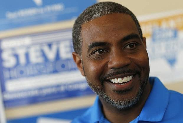 FILE - In this Nov. 6, 2018, file photo, Steven Horsford, Democratic candidate for Nevada&#039;s fourth congressional district, visits a Democratic office in Las Vegas. Horsford said in calling for U.S. Energy Secretary Rick Perry to &quot;resign immediately&quot; that the new disclosure is further evidence that Nevada has been covertly &quot;coerced&quot; into illegally receiving nuclear materials &quot;through negligence or outright trickery.&quot; (AP Photo/John Locher, File)