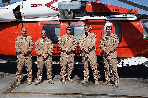 NAVAL AIR STATION FALLON, NV (July 12, 2019) The Longhorn Helicopter Search and Rescue (SAR) team from Naval Air Station (NAS) Fallon  conducted a night rescue at Black Wall near Donner Summit, extracting and airlifting an injured rock climber 11 July. The crew that participated in the rescue are, from left to right, Lt. Cary Lawson, Petty Officer 2nd Class Jacob Glende, Petty Officer 1st Class Kyle Kurzendoerfer,  Cmdr. Chris Joas, and Lt. Drew Bilton-Smith. U.S. Navy Photograph by Mass Communication Specialist 1st Class Larry S. Carlson.)