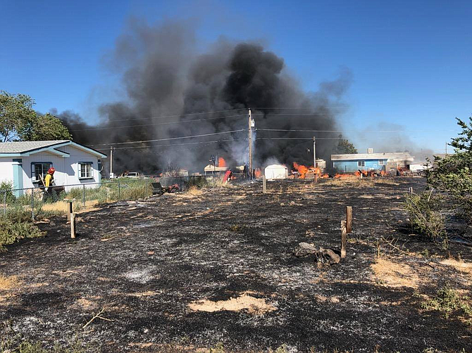 Two homes were lost in a fire Monday in Silver Springs, according to Lyon County officials.