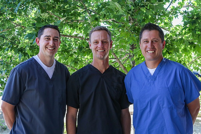 Kevin Olson, DMD, left, and Jeremy John, DMD, right, of Carson City Pediatric Dentistry welcome Andy Ingersoll, DMD, center, and celebrate the grand opening of Dayton Pediatric Dentistry, which opens Aug. 6. An open house takes place from 1 to 3 p.m. Aug. 3.