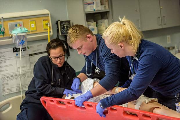 From left, Asyah Williams, Kyle Miller and Kelsey Hein work in an EMS class on March 28 at Western Nevada College in Carson City.