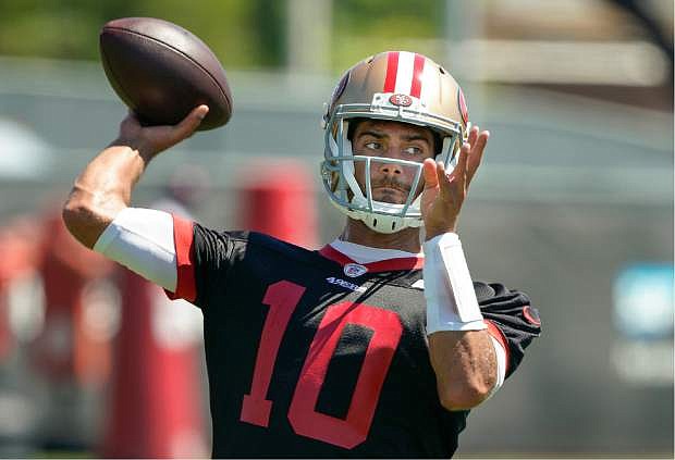 49ers quarterback Jimmy Garoppolo throws a pass during a drill at the team&#039;s training facility in Santa Clara, Calif., on June 10.