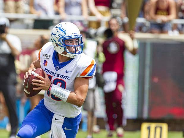 Boise State quarterback Hank Bachmeier (19) rolls out to pass in the first half of an NCAA college football game against Florida State in Tallahassee, Fla., Saturday, Aug. 31, 2019. (AP Photo/Mark Wallheiser)