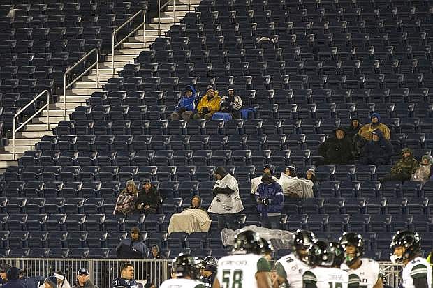 A sparse and cold Nevada crowd watches the end of Saturday&#039;s game against Hawaii in Reno.