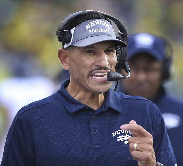 Nevada head football coach Jay Norvell calls instructions from the sidelines against Oregon on Saturday in Eugene, Ore.