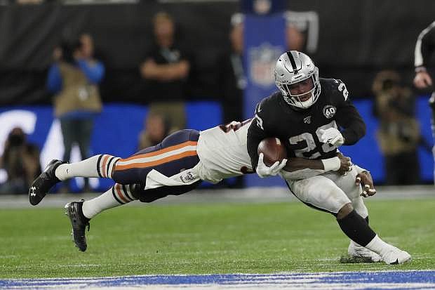 Oakland Raiders running back Josh Jacobs (28) is tackled during the second half of an NFL football game against the Chicago Bears at Tottenham Hotspur Stadium, Sunday, Oct. 6, 2019, in London. (AP Photo/Kirsty Wigglesworth)