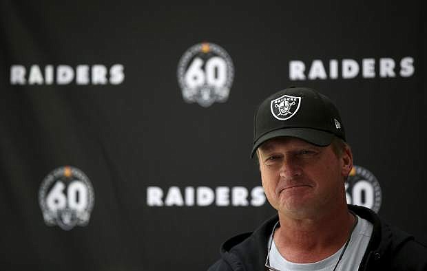 Oakland Raiders head coach Jon Gruden attends a press conference during the media day at The Grove Hotel, Watford, England, Friday, Oct. 4, 2019. The Oakland Raiders are preparing for an NFL regular season game against the Chicago Bears in London on Sunday. (Steven Paston/PA via AP)