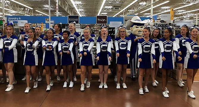 CHS Cheerleaders perform at Walmart in appreciation for a 5000 grant.