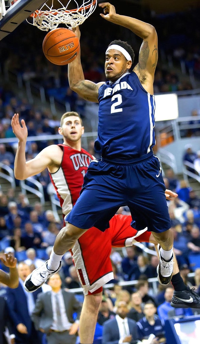 Tyron Criswell throws down a dunk while playing at the University of Nevada. Criswell has been playing professionally overseas and is looking to get drafted by the NBA G-League come Saturday. 