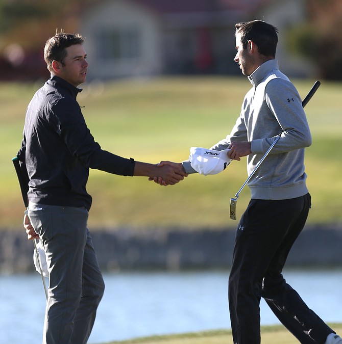 Trent Virden of Reno, Nevada, left, shakes hands with Connor Blick (Alamo, California) after the pairing complete the third round of the Korn Ferry Qualifier at Dayton Valley Golf Course. 