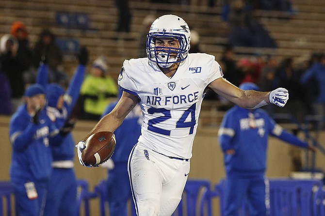 Air Force running back Kadin Remsberg celebrates after rushing for a touchdown against Utah State in the second half of an NCAA college football game Saturday, Oct. 26, 2019, at Air Force Academy, Colo. Air Force won 31-7. (AP Photo/David Zalubowski)