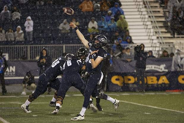 Nevada quarterback Carson Strong passes in the rain against Hawaii on Sept. 28 in Reno.