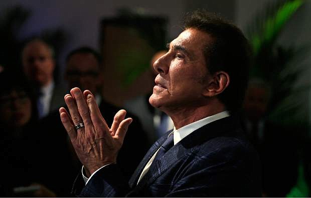 FILE - In this March 15, 2016, file photo, casino mogul Steve Wynn gestures listens during a news conference in Medford, Mass. Nevada&#039;s gambling regulators have filed a complaint against the former casino magnate that could bar him from ever working in the gaming industry in the state. The state&#039;s Gaming Control Board filed a complaint Monday, Oct. 14, 2019, listing sexual misconduct allegations that have been lodged against the mogul since January 2018. (AP Photo/Charles Krupa, File)