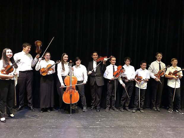 Symphony Youth Strings advanced student ensemble, STRAZZ, hamming it up last year.