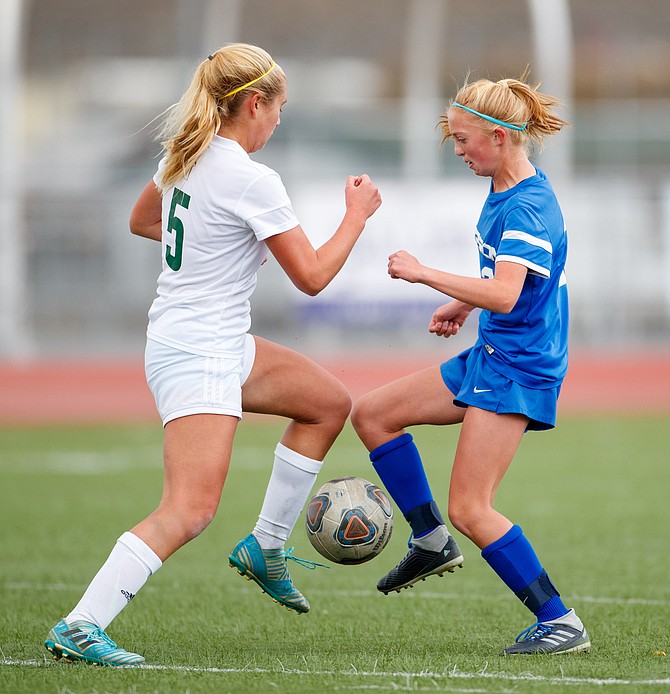 Carson&#039;s Gracie Walt battles with Manogue&#039;s Kylie Debruin during the NIAA Northern Division 1 soccer match between the Bishop Manogue Miners and Carson High Senators at Carson High School.