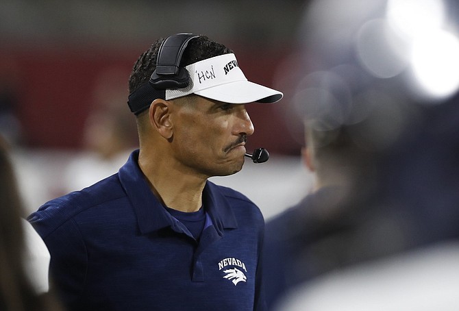 Nevada coach Jay Norvell watches his team on their winning drive against Fresno State during the second half of an NCAA college football game in Fresno, Calif., Saturday, Nov. 23, 2019. (AP Photo/Gary Kazanjian)