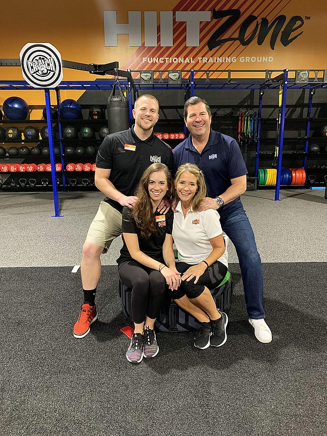 The Shepanek family takes a poses for a photo in the HIIT Zone as Cruch Reno, which opened in late August. Pictured are Tyler and John Shepanek, back row left to right, alongside Tyler&#039;s fiance and executive operations manager Eric McCabe, front left, and Karin Shepanek.