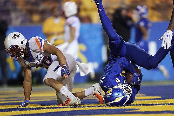 San Jose State wide receiver Bailey Gaither (84) catches a touchdown pass in front of Boise State cornerback Avery Williams (26) during the second half Saturday in San Jose, Calif. Boise State won 52-42.