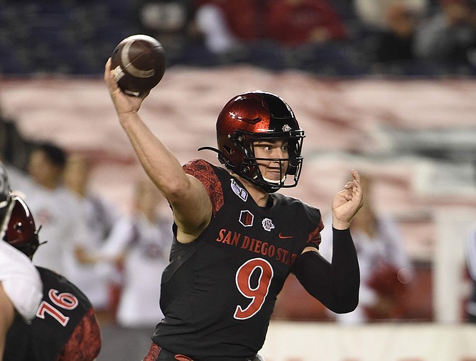 San Diego State quarterback Ryan Agnew (9) delivers a pass during the first half of a college football game against Nevada Saturday, Nov. 9, 2019, in San Diego. U.S. (AP Photo/Denis Poroy)