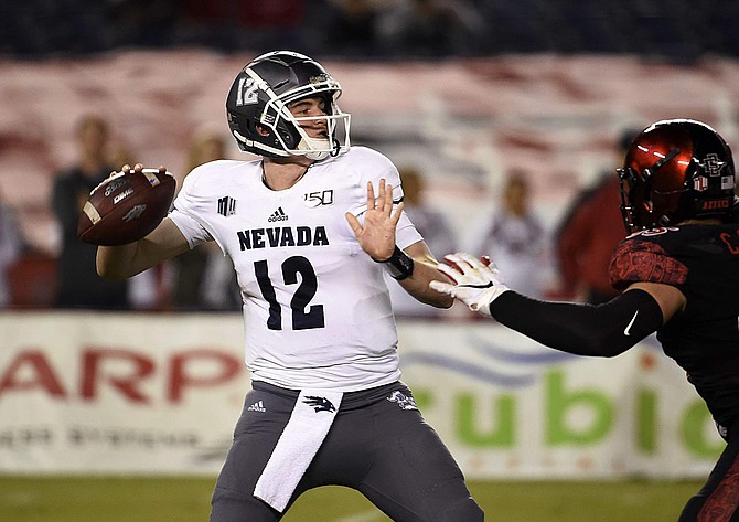 Nevada quarterback Carson Strong (12) delivers a pass during the first half of the team&#039;s NCAA college football game against San Diego State on Saturday, Nov. 9, 2019, in San Diego. (AP Photo/Denis Poroy)