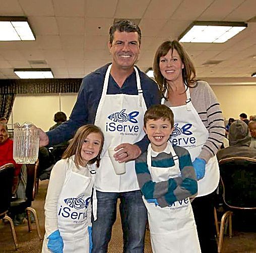 Dean DiLullo, Carson Nugget Casino/Hotel owner and general manager, with his family serves dinner at a recent Community Thanksgiving Feast.