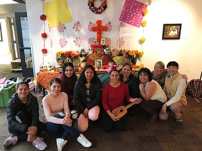 2019 Dia de los Muertos altar contest winners: The winners of the altar contest at the Dia de los Murertos event on Oct. 31, from left, are Erika Romo-Reyes, Azucena Acosta, Nancy Galaviz, Rosa Pureco, Alba Madera, Rafaela Herrera, Maricela Lopez and Hou Ling, with English Language Learning instructor Jody Coxon (second from right).