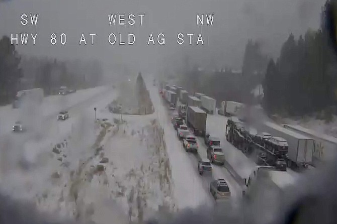 In this still image taken from a Caltrans remote video traffic camera, traffic is stopped along Interstate 80 because of multiple spinouts on Tuesday in Truckee, Calif.