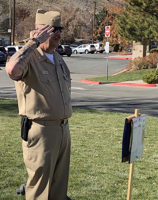 U.S. Naval Sea Cadet Corps Lt. Cdr. Robert Bledsaw, attending the Carson Middle School Veterans Day concert Thursday, salutes the stakeout and the veterans honored on the front lawn. Bledsaw has been involved in leading local youth programs in Carson City for a number of years, and he said he was moved by Carson&#039;s music program this week.