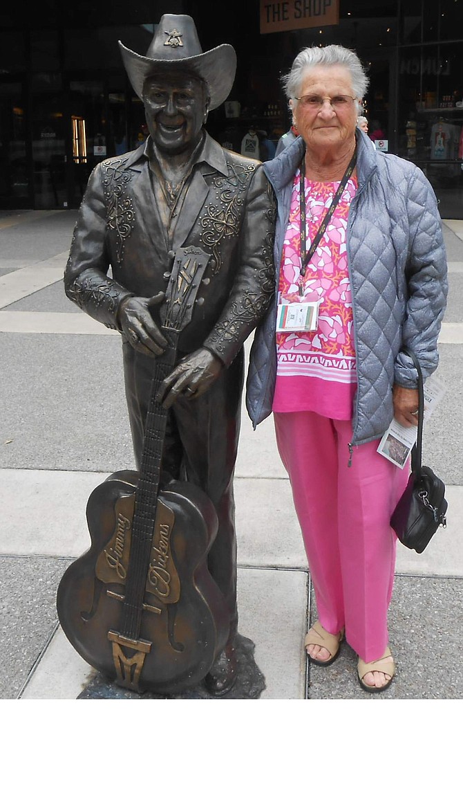 Marilyn poses with the statue of Little Jimmy Dickens outside the Grand Ole Opry in Nashville.