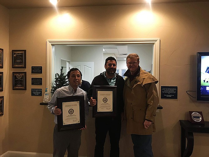 Nevada U.S. Rep. Mark Amodei, far right, presented Certificates of Congressional Recognition for 20 years of exceptional care to Drs. Ziqiang Wu and Matti Vazeen with Center for Advanced Eye Care.