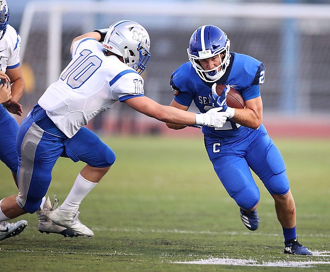 Carson High senior Bradley Maffei carries the ball against McQueen earlier this season. Maffei was chosen as a second team all-Sierra League selection after posting 733 yards and six touchdowns on the ground this past season.